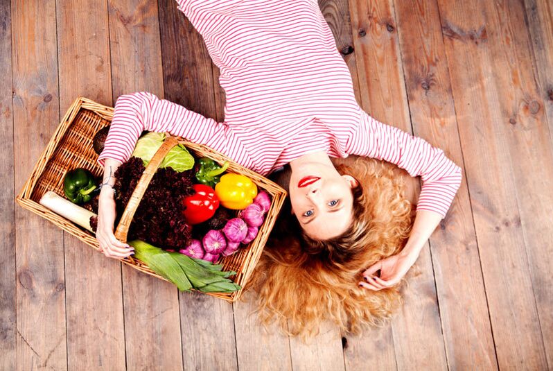 Girl with a basket of vegetables